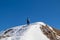 Active woman on a snow shoe track leading to mountain summit Freiberg near Zell Pfarre (Sele), Austrian Alps, Carinthia