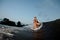 Active woman standing on the one knee on the wakesurf