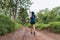 Active woman trail runner running in park outdoor