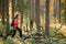 Active Young Adult Beautiful Caucasian Lady Woman Dressed In Red Jacket Walking In Autumn Green Forest. Active Lifestyle
