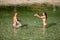 Active young couple plays in shallow water on a hot summer morning