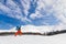 Active young man backcountry skiing on a beautiful sunny day, wi