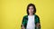 Active young video blogger on yellow background