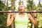 Active and young woman doing pullups