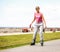 Active young woman rollerskating outdoor.