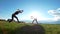 Active young women performs acrobatic stunts on the grass at summer sunset