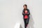 Activewear Asian girl model woman leaning on wall in yoga leggings and running jacket ready to train at gym. Active