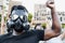 Activist wearing gas mask protesting against racism and fighting for equality - Black lives matter demonstration on street