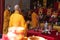 Activity of the monks while praying together in the temple in front of the altar