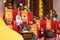 Activity of the monks while praying together in the temple in front of the altar