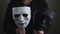 Actor with masks at the opera theater plays theatrical play tragic comedy in different roles