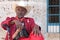 Actor playing for tourists with a big cigar