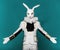 Actor posing in white rabbit suit on color blue