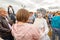 actor of the St. Petersburg Theater Non Stop Theater after a street performance hugs a fan on the waterfront at the festival `Vo