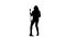 Actress in a retro microphone sings a rock song. White background. Silhouette. Slow motion