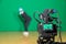 Actress in theatrical costume in a television Studio. Green screen and chroma key. Lighting equipment and filming equipment