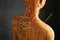 Acupuncture - alternative medicine. Human model with needles in shoulder against dark grey background