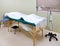 Acupuncture, Massage Table & Heat Lamp In Treatment Room