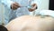 Acupuncture therapist placing a cup on the back of a male patient, ancient Chinese alternative medicine. Close up for a