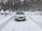 Acura TLX AWD in the snow in winter with lights on