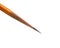 An acutely honed pencil on a white background