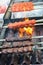 Adana kebab ground lamb minced meat on skewer on grill over charcoal