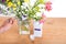 Add bleach powder into vase with water to keep flowers fresher