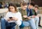 Addicted teen girl using smartphone outdoors