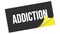 ADDICTION text on black yellow sticker stamp