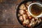 Adding broth in the pan with meat and vegetable top view