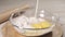 Adding milk to flour and egg