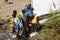 Addis Abeba, Ethiopia, January 15 2015: Locals fill up their canisters with diesel that spills out of an overturned tanker truck