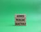 Address Problems Objectively symbol. Wooden blocks with words Address Problems Objectively. Beautiful green background. Business