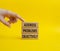 Address Problems Objectively symbol. Wooden blocks with words Address Problems Objectively. Beautiful yellow background.