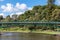 The Adelaide University Footbridge over river Torrens Karrawirra Parri. People at the park walking, fishing, riding a bike.