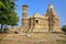 Adhbudhnath Shiva Temple, located inside the fort Garh of Chittorgarh, Rajasthan, India, with the Tower of Fame on the left side