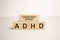 ADHD Abbreviation on ADHD cubes on a light background. Close ADHD - Attention Deficit Hyperactivity Disorder
