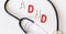 ADHD Abbreviation ADHD in multicolored letters on a white background with a stethoscope