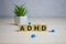 ADHD word on wooden cubes, medical concept background