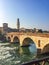 Adige River and fortified bridge Verona Castel Vecchio Bridge. Verona, Italy
