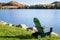 Adirondack Chair Facing a Mountain Lake on a Sunny Morning