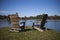 Adirondack Chairs Next to a Lake in the Autumn