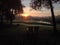 Adirondack Chairs and Sunrise over a Lake