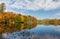 Adirondack lake in St Regis Wilderness with peak fall foliage on a peaceful calm morning