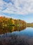 Adirondack lake in St Regis Wilderness with peak fall foliage on a peaceful calm morning