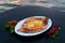 Adjarian khachapuri with eggs on table