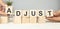 ADJUST word made with building blocks