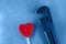 Adjustable gas wrench and red heart on a blue textured background. The beauty and the Beast