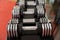 Adjustable weight dumbbells in a row with selective focus