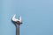 Adjustable wrench on blue background. Close up single steel adjustable wrench with shadow